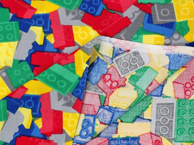Bavlněná látka barevné lego metráž značky Škodák.