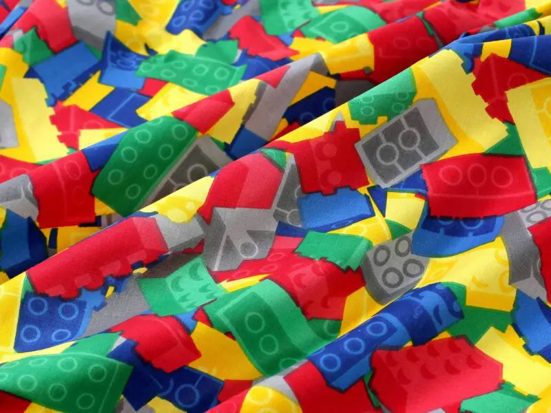 Bavlněná látka barevné lego metráž značky Škodák.