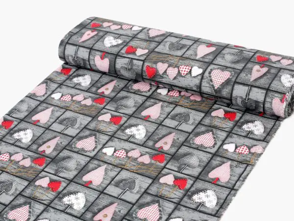 Bavlněná látka patchwork červená srdce metráž značky Škodák.