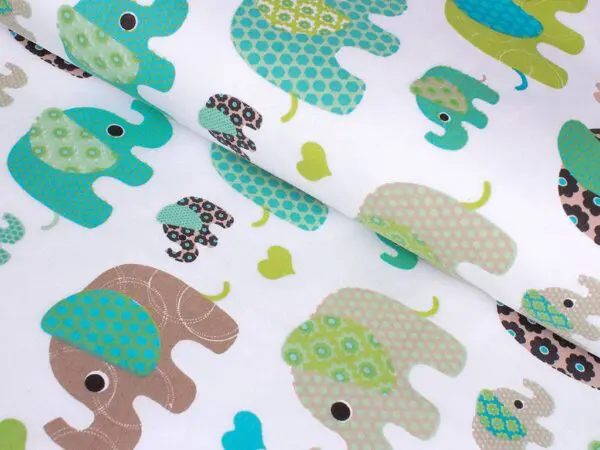Bavlněná látka zelení a tyrkysoví sloníci metráž značky Škodák.