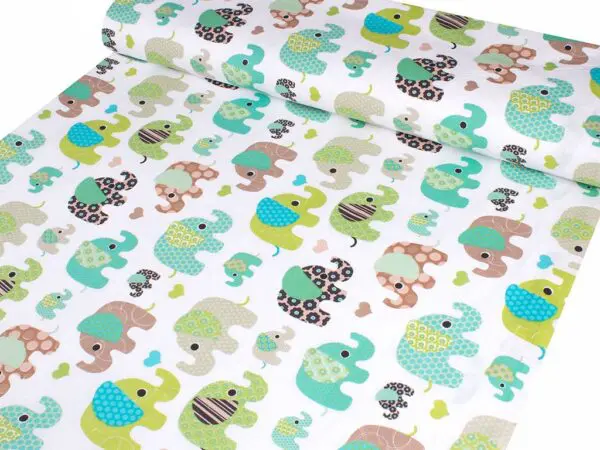Bavlněná látka zelení a tyrkysoví sloníci metráž značky Škodák.