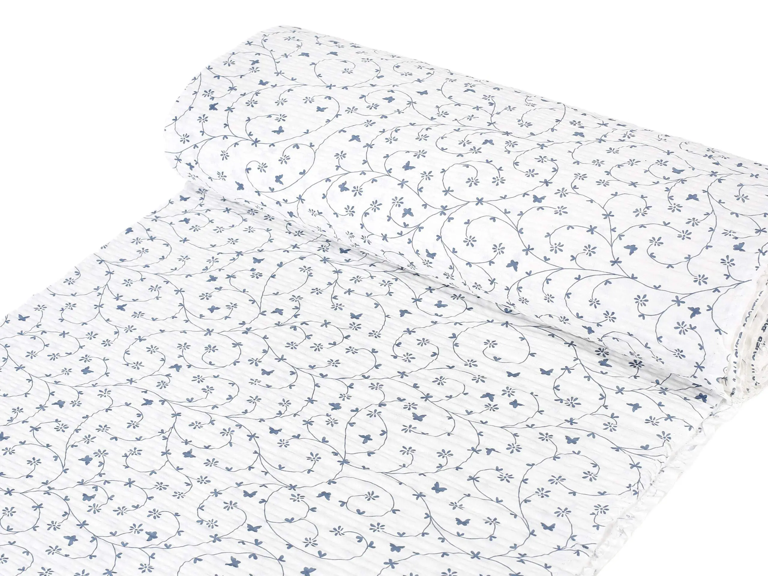 Krepová látka modří motýlci na bílé metráž značky Škodák.