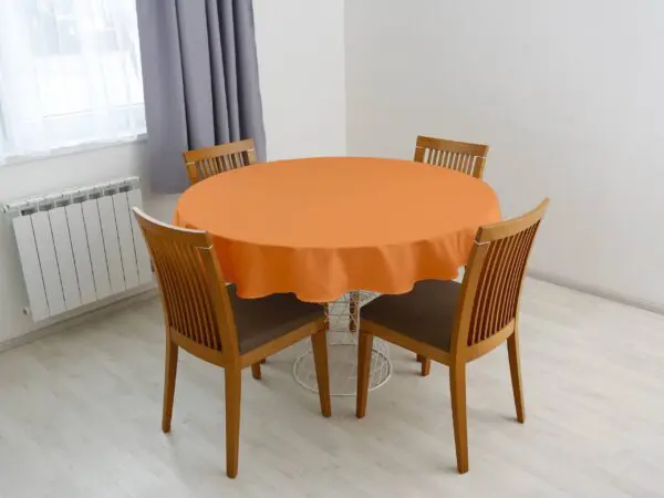 Bavlněný kulatý ubrus oranžový značky Škodák.