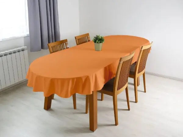 Bavlněný oválný ubrus oranžový značky Škodák.