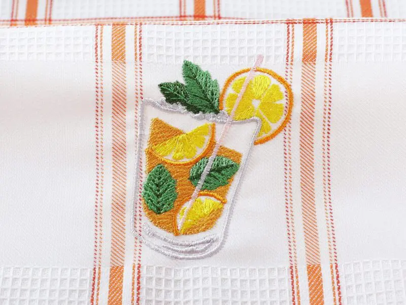 Vaflová utěrka s výšivkou juice na oranžovém káru 45x70cm značky Škodák.