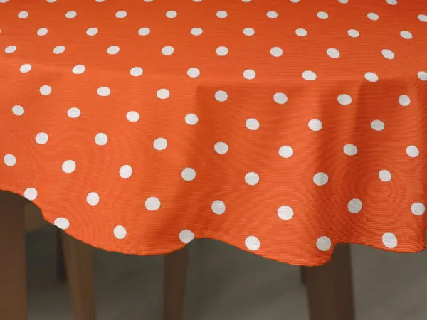 Oválný ubrus Loneta puntíky na oranžové značky Škodák