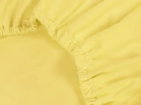 Jersey prostěradlo s napínací gumou žluté značky Škodák