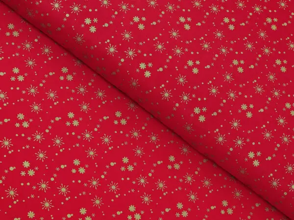 Bavlněná látka zlaté vločky na červené metráž šířka 142 cm značky Škodák.