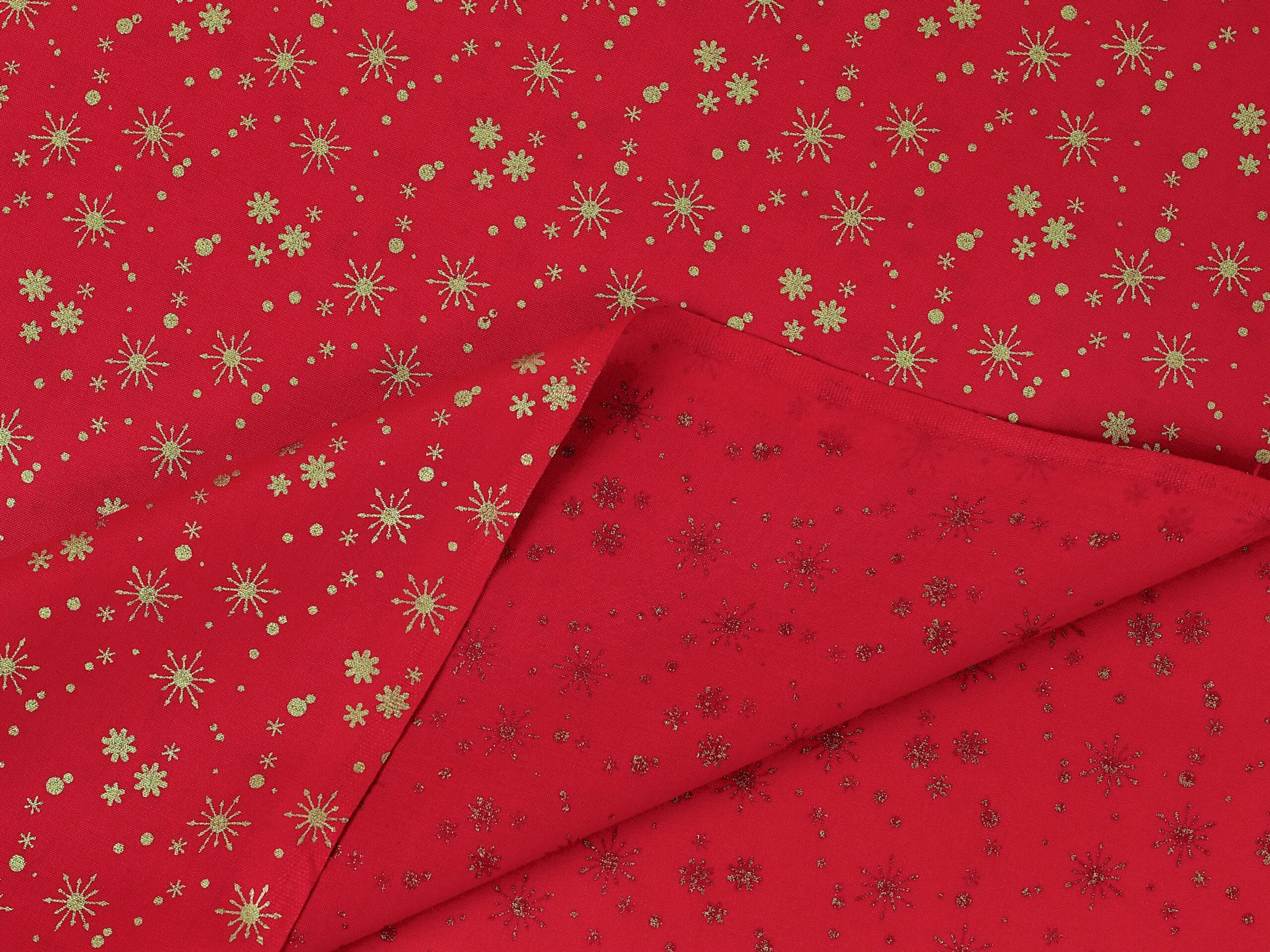 Bavlněná látka zlaté vločky na červené metráž šířka 142 cm značky Škodák.