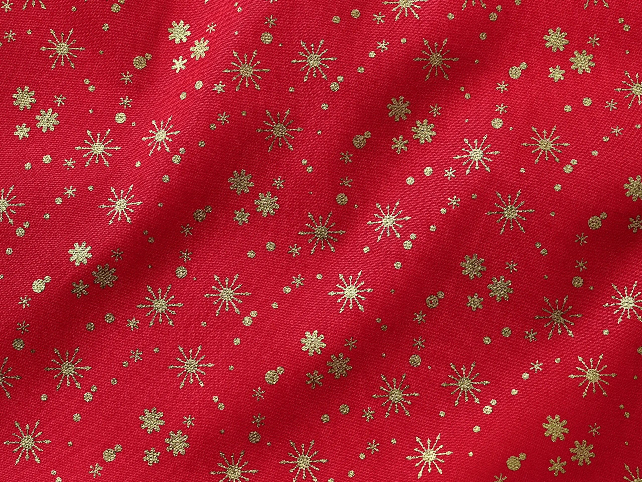 Bavlněná látka zlaté vločky na červené metráž šířka 142 cm značky Škodák.