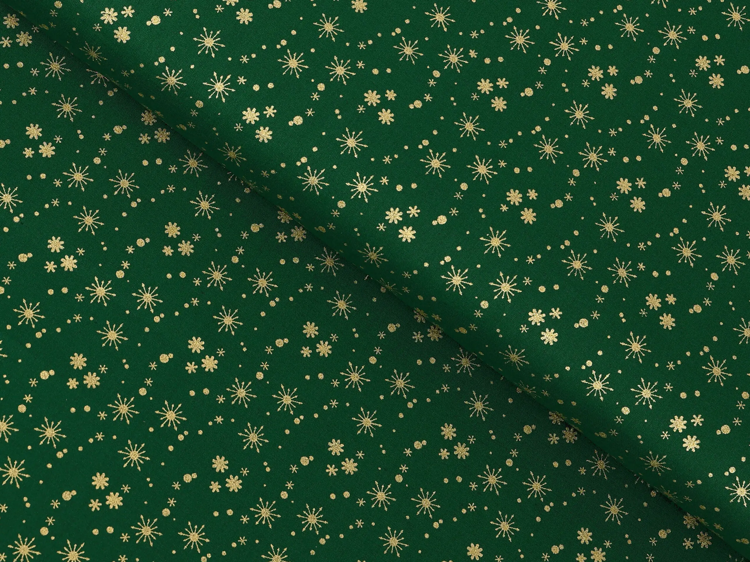 Bavlněná látka zlaté vločky na zelené metráž šířka 142 cm značky Škodák.