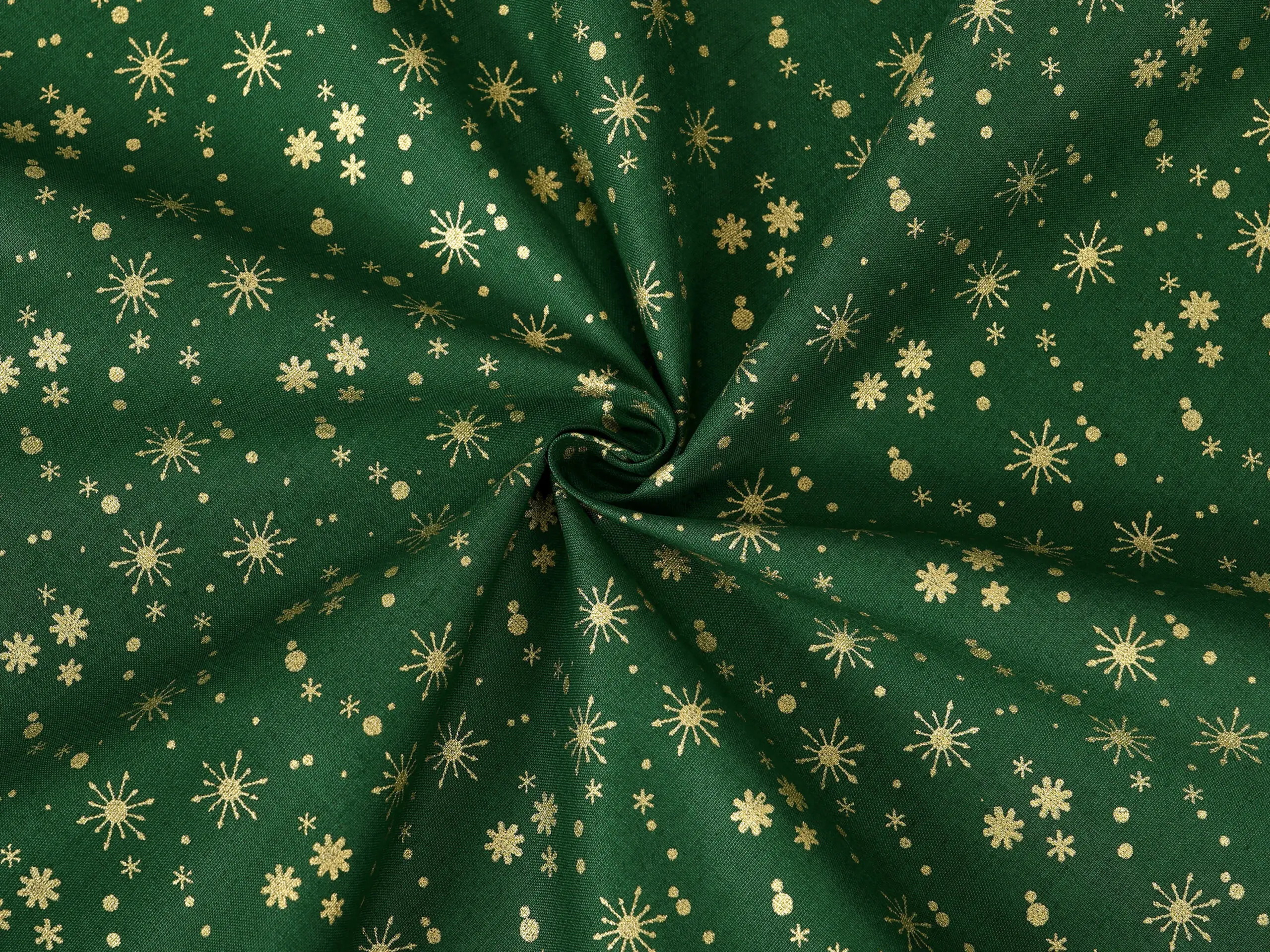 Bavlněná látka zlaté vločky na zelené metráž šířka 142 cm značky Škodák.