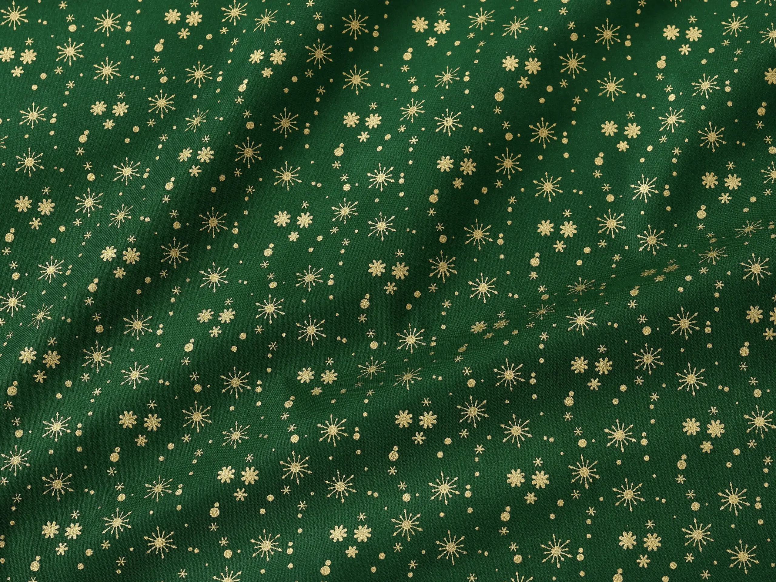 Bavlněná látka zlaté vločky na zelené metráž šířka 142 cm značky Škodák.