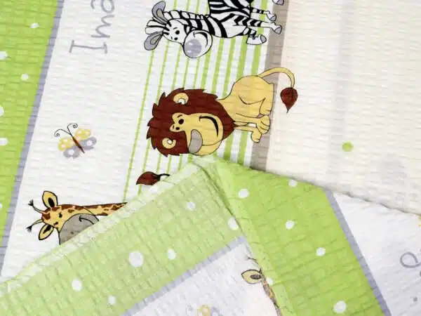 Krepová látka slon, lev a zebra metráž značky Škodák.