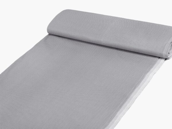 Bavlněná látka malé puntíky na šedé metráž značky Škodák.