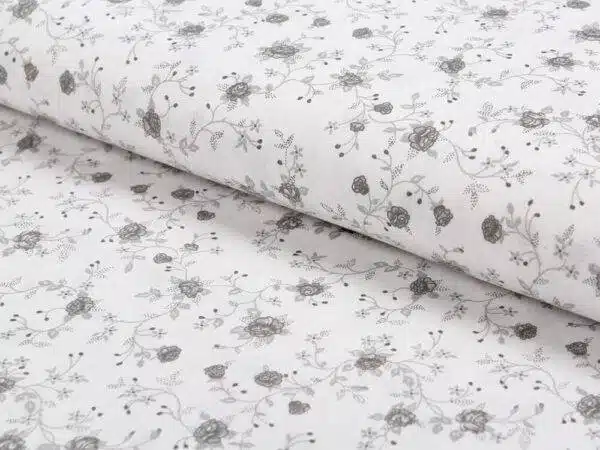 Bavlněná látka šedé růže na bílé metráž značky Škodák.