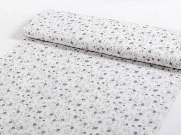 Bavlněná látka šedé růže na bílé metráž značky Škodák.