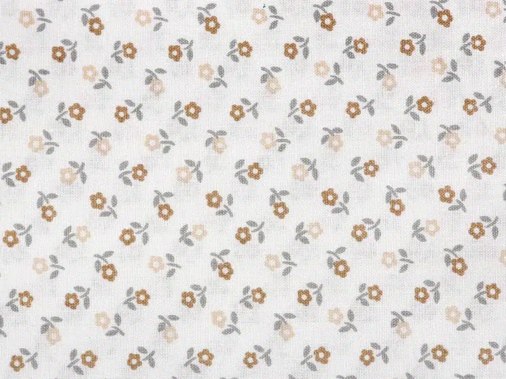 Bavlněná látka béžové kytičky na bílé metráž značky Škodák.