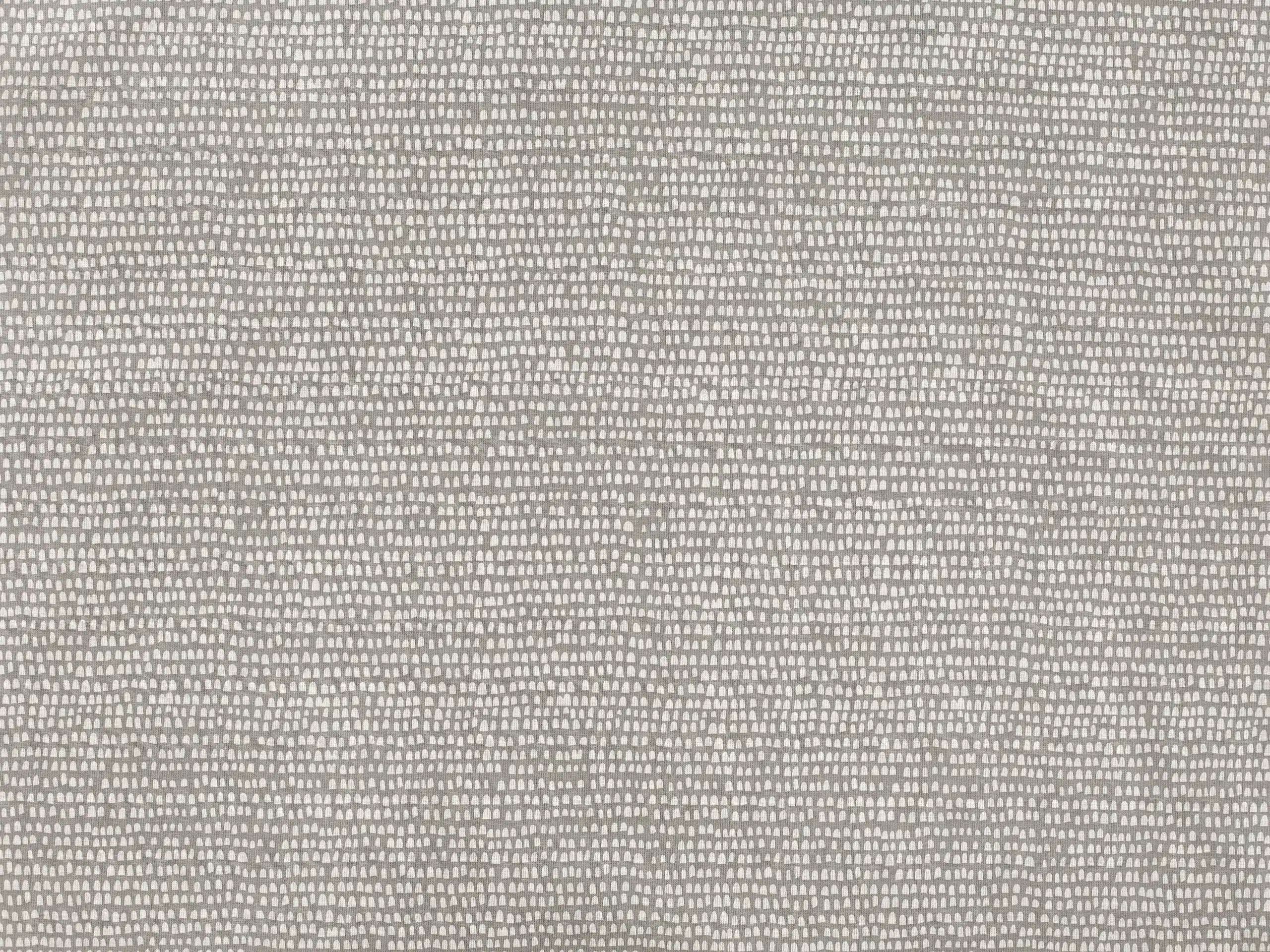 Bavlněná látka zrníčka na šedé metráž značky Škodák.