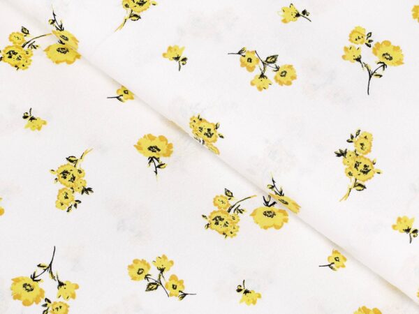 Bavlněná látka žluté květy na bílé metráž značky Škodák.
