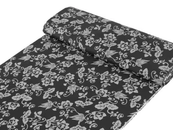 Bavlněná látka šedé květiny na antracitové metráž značky Škodák.