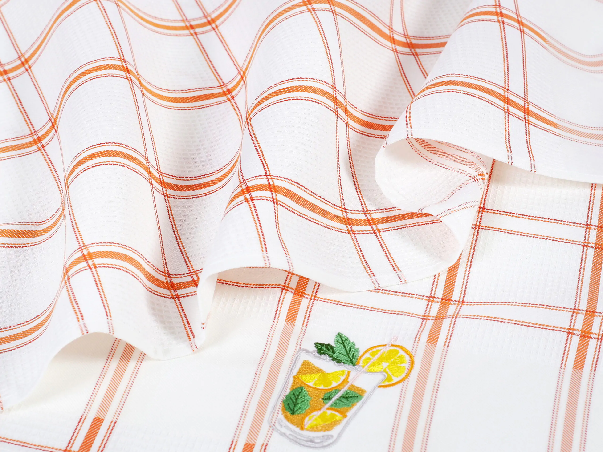 Vaflová utěrka s výšivkou juice na oranžovém káru 45x70cm značky Škodák.