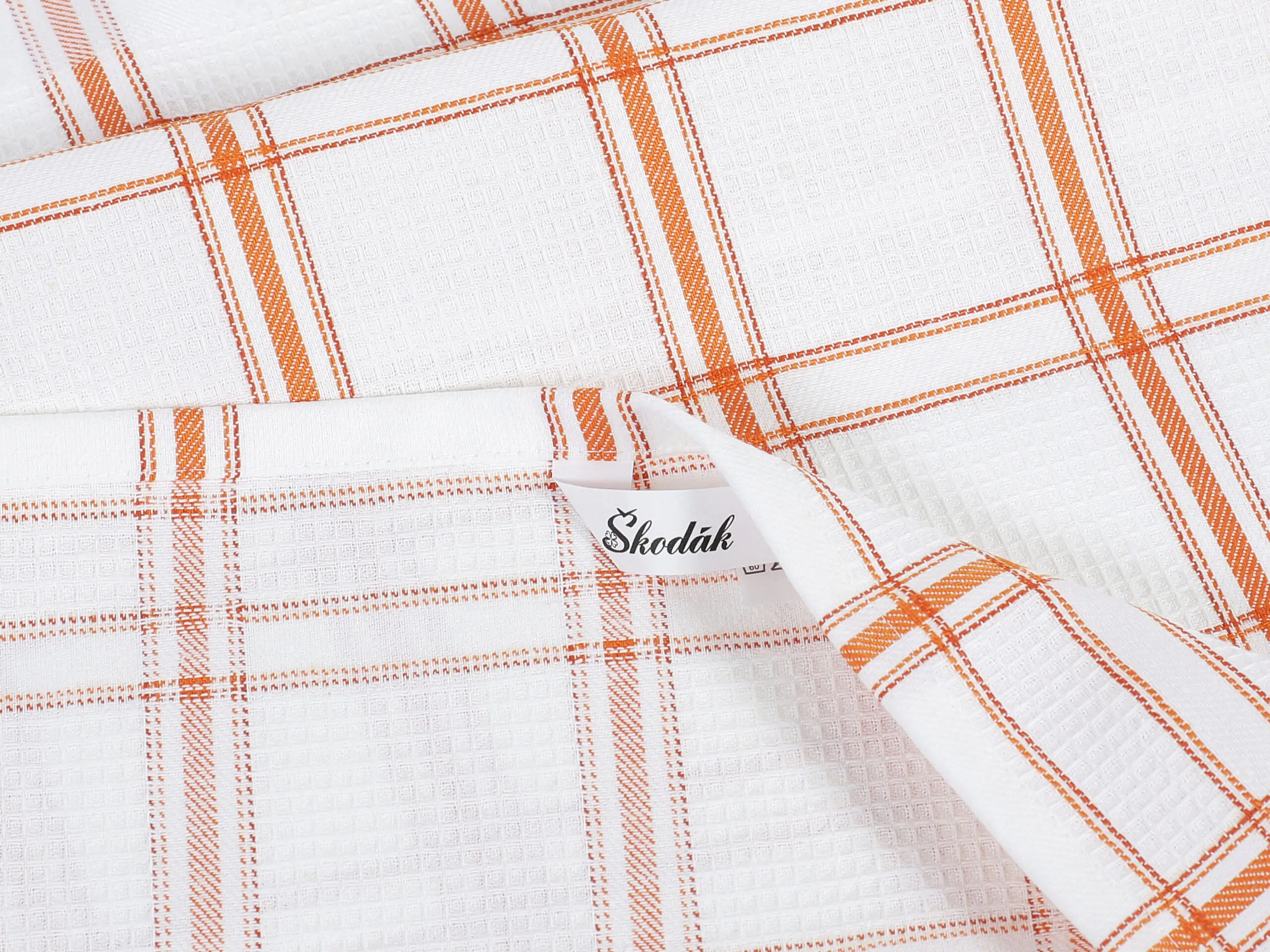 Vaflová utěrka s výšivkou juice na oranžovém káru 45x70cm značky Škodák.