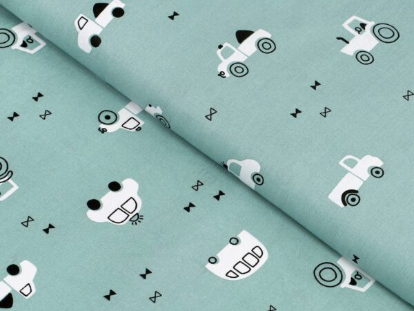 Bavlněná látka bílá autíčka na zelené metráž značky Škodák