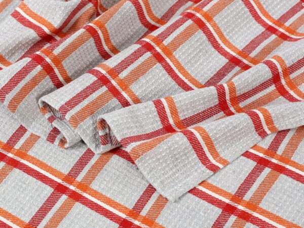 Polovaflová utěrka pestře tkaná oranžovo-červené káro na šedé značky Škodák