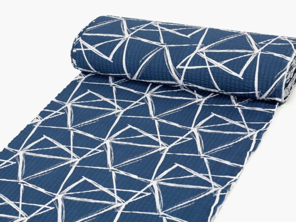 Krepová látka bílé trojúhelníky na modré značky Škodák