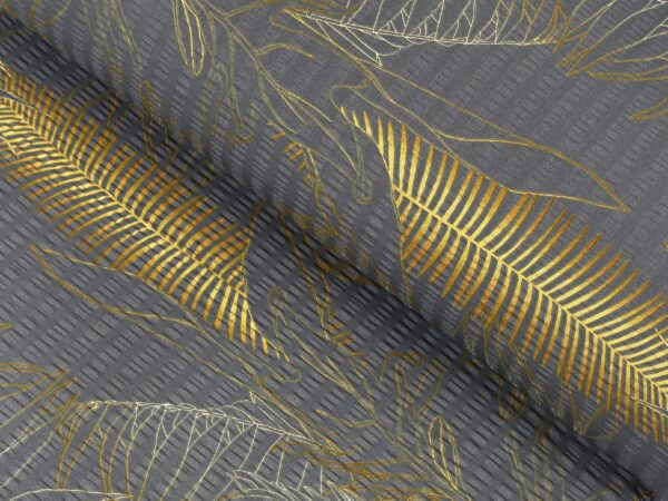 Krepová látka zlaté listy na šedé metráž značky Škodák