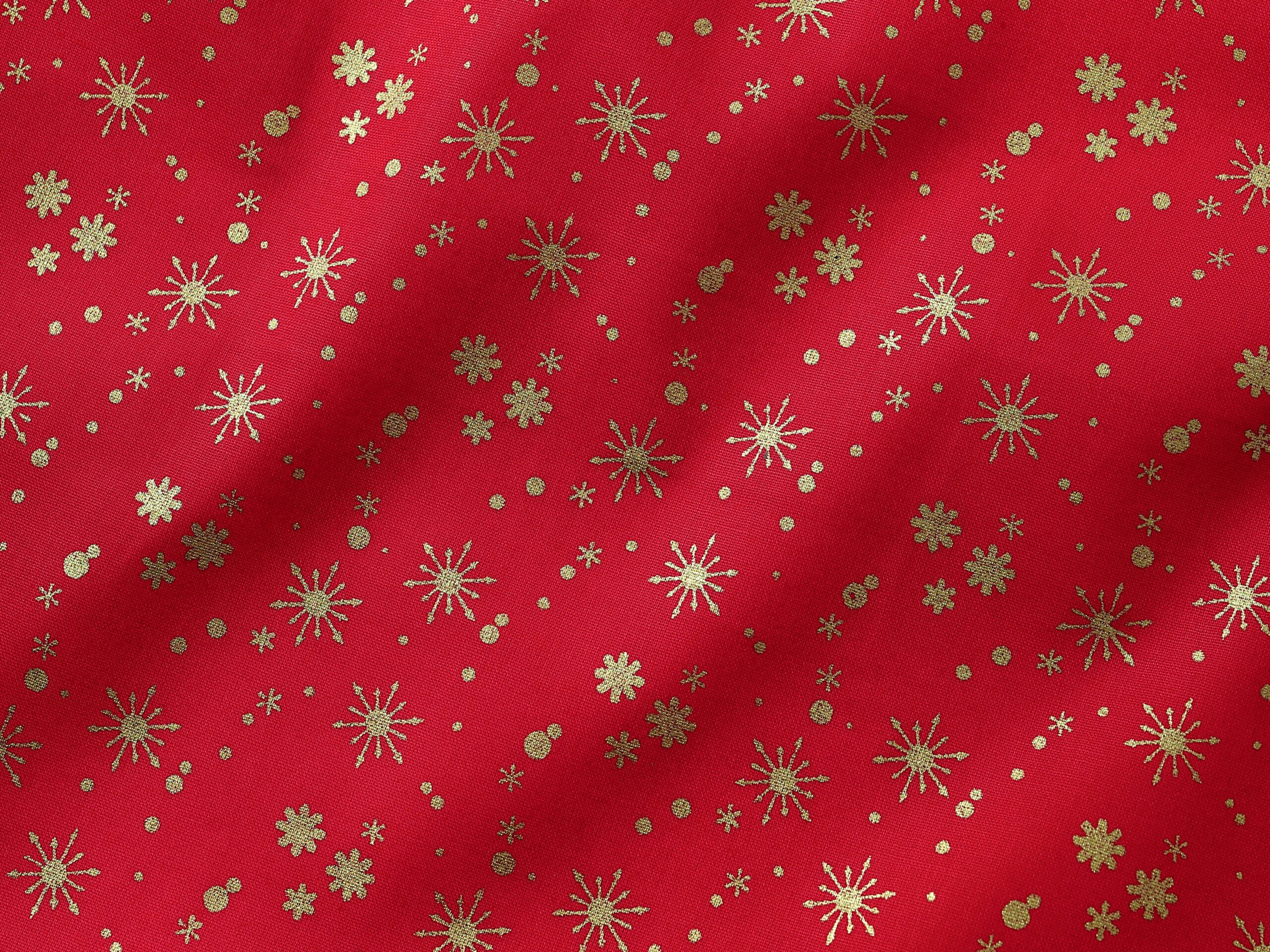 Bavlněná látka zlaté vločky na červené metráž šířka 142 cm značky Škodák.